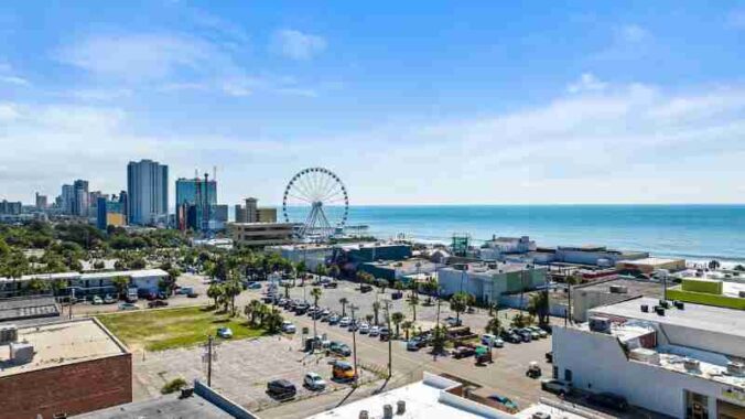 A vibrant aerial view of Myrtle Beach cityscape with Ferris wheel and ocean in the background., tags: die - pexel